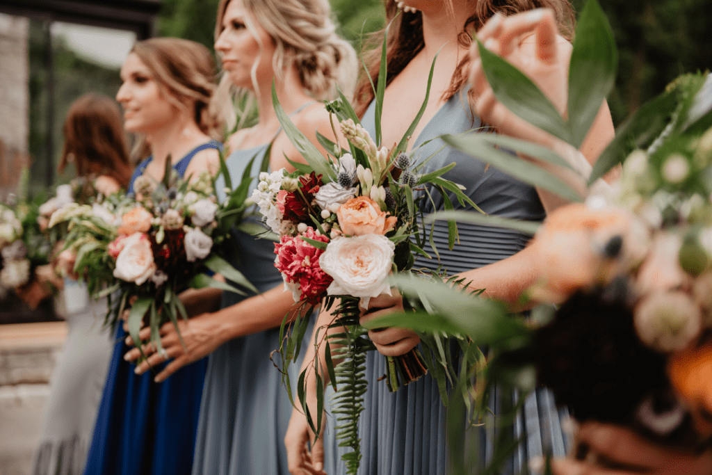 bridesmaids holding flowers at wedding rehearsal