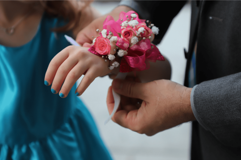 pink corsage on little girls hand